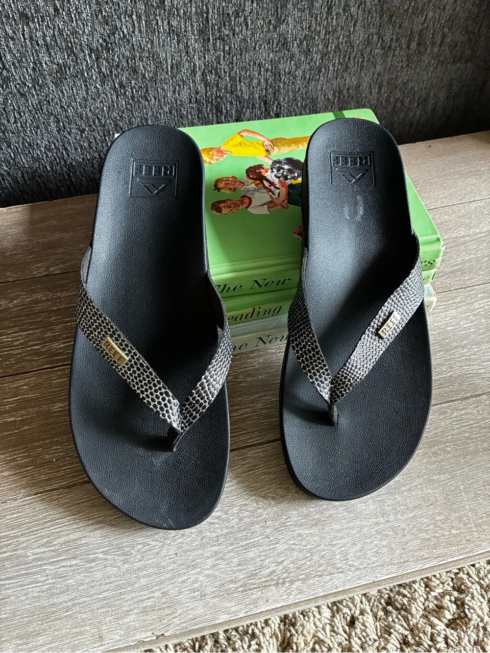 Reef Black Cushion Court Flip Flops with Snakeskin-Pattern Straps and Gold Logo